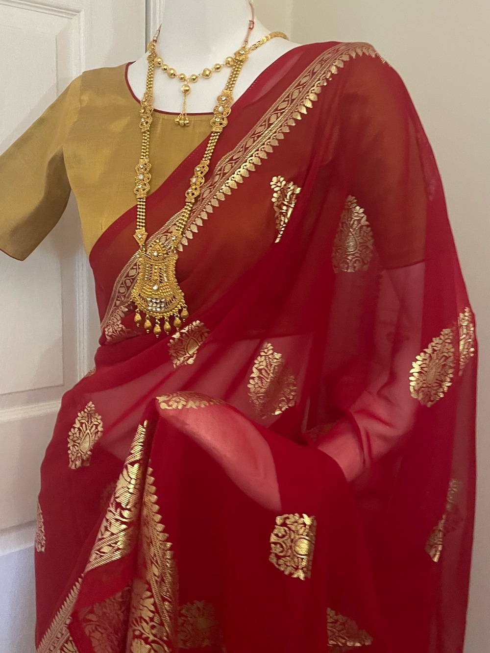 Elegant Red Georgette Saree with Gold Buti and Border